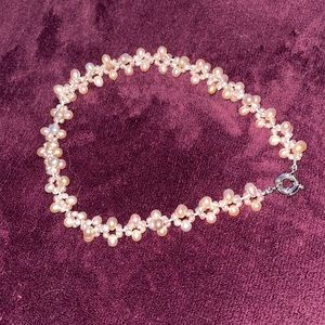 Preloved freshwater pearls excellent condition. Color is pink. Size is 18” long